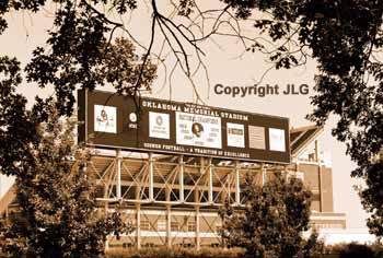 Stadium Sign through Trees